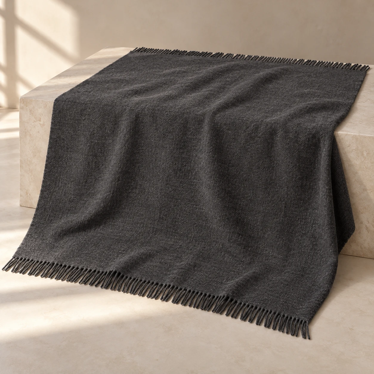 Charcoal Nest wool-blend throw — Charcoal; a deep charcoal field